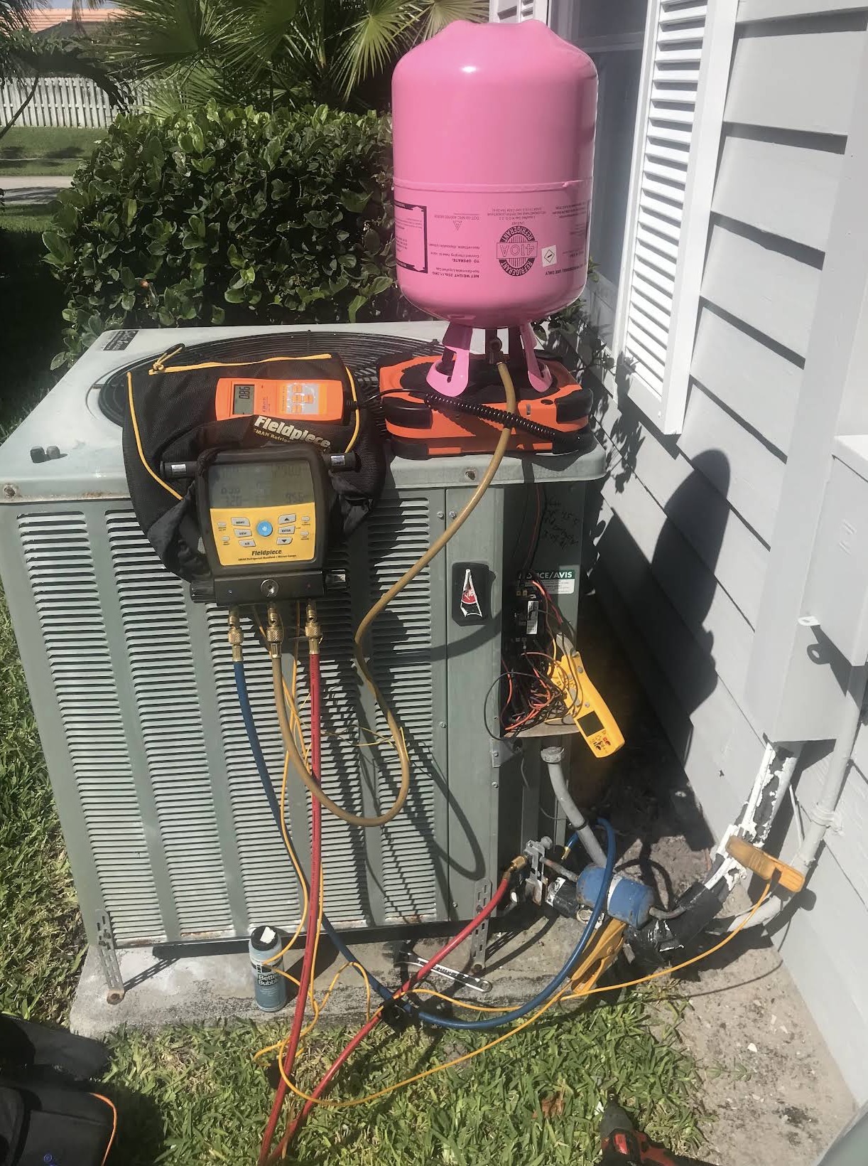 Refrigerant charging with digital manifold gauges and scale