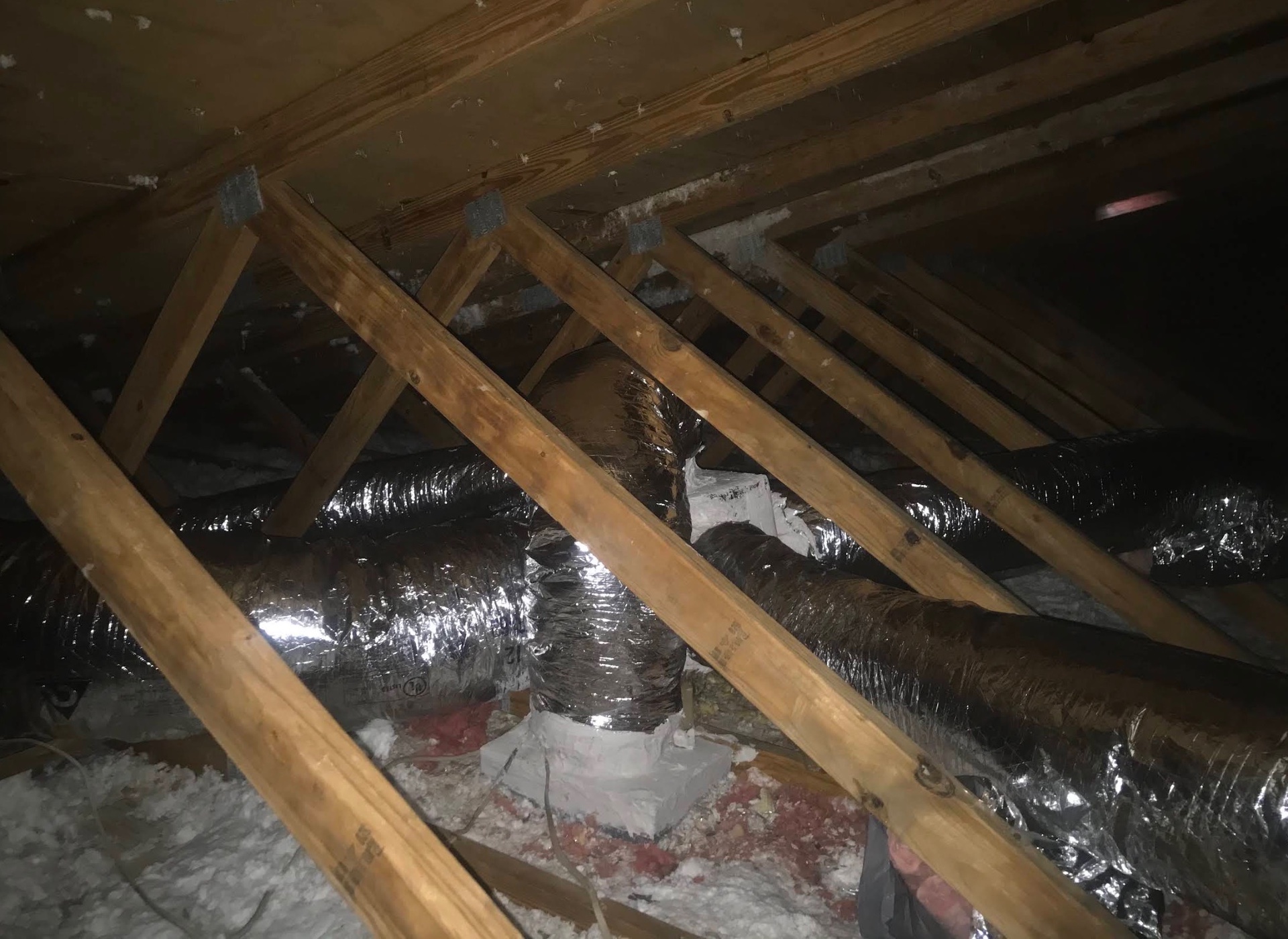 New insulated flex duct runs installed in an attic