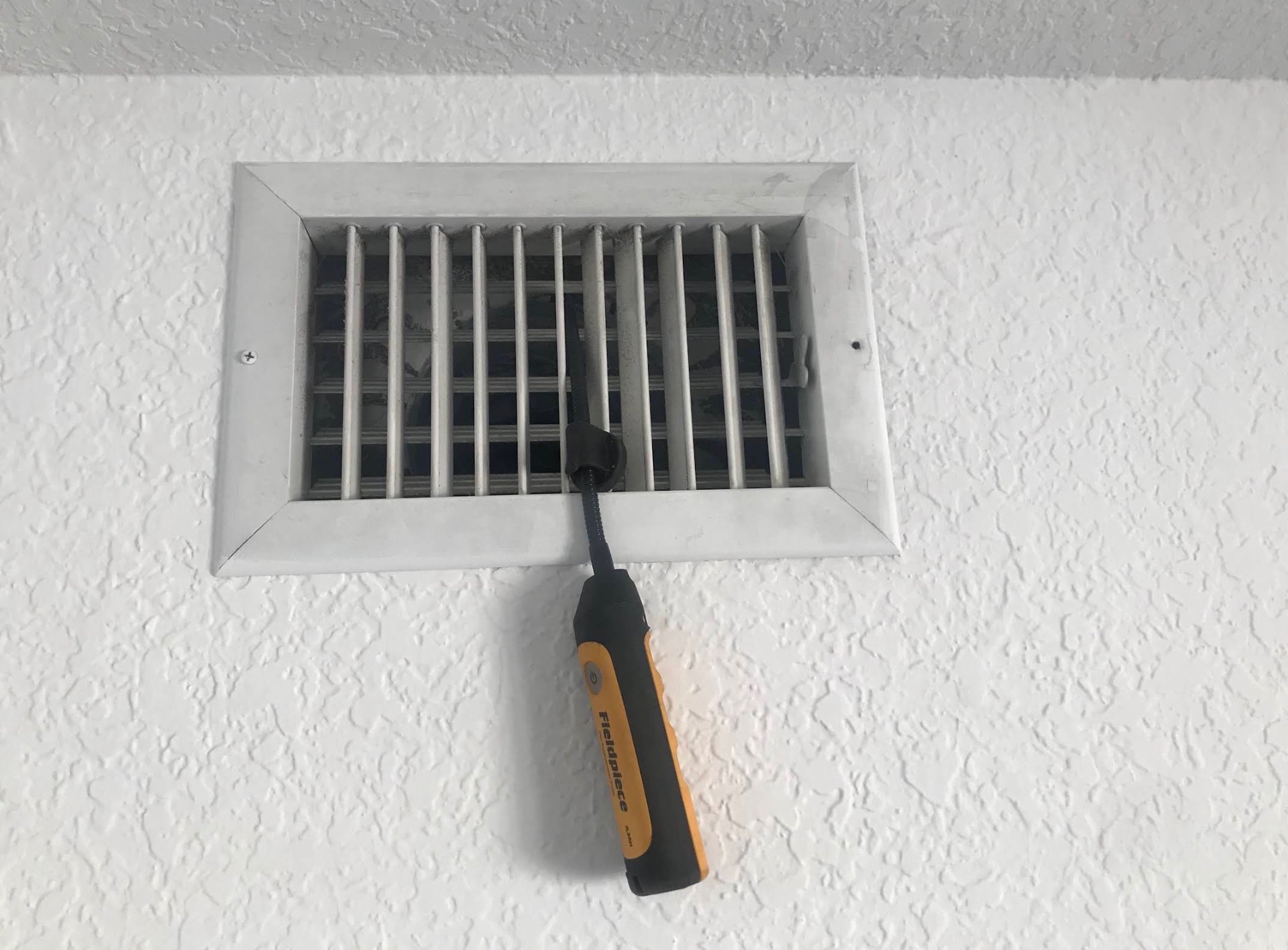 Airflow and temperature readings taken at a supply vent