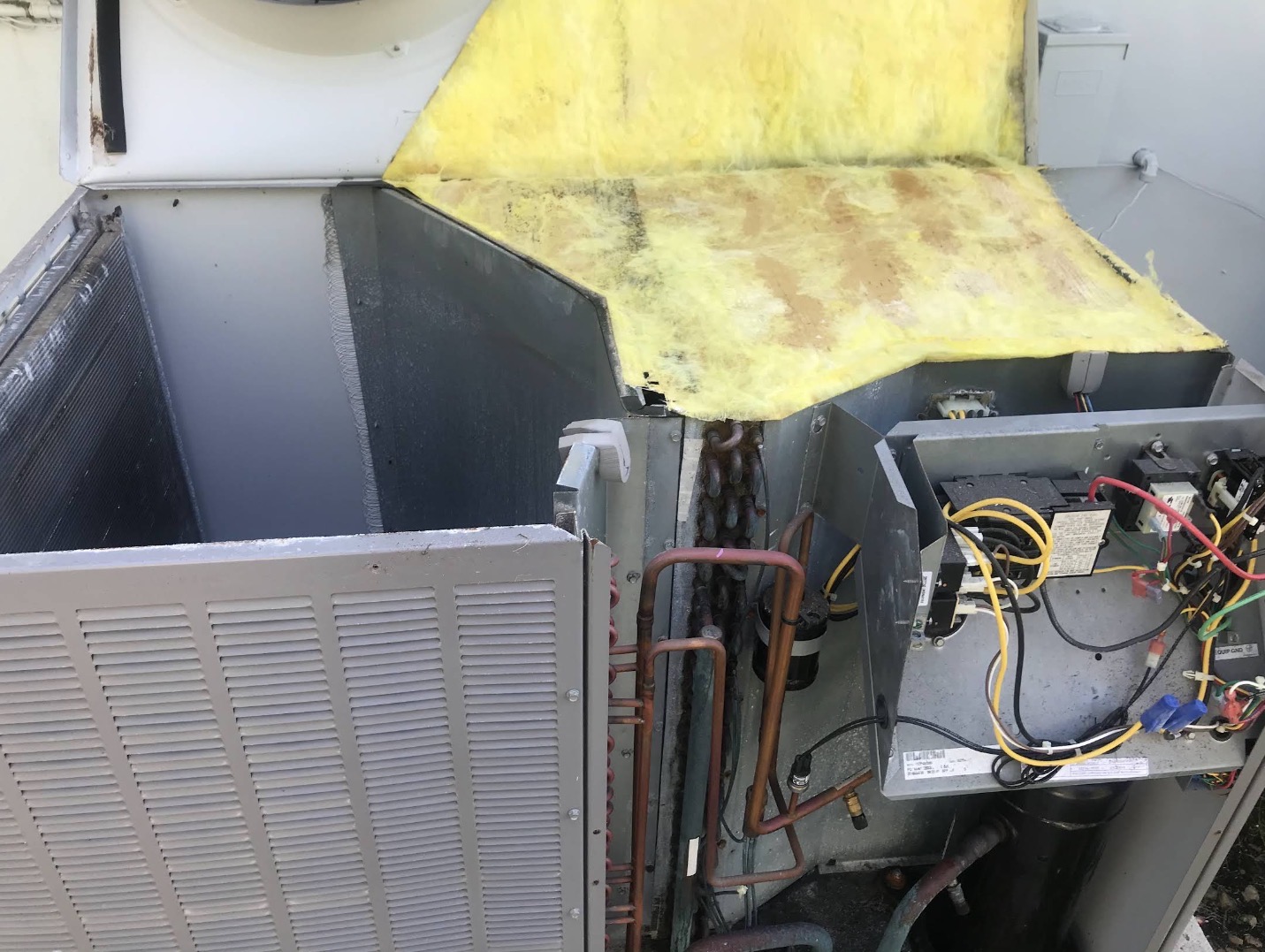 Air handler opened up for electrical and refrigerant diagnostics