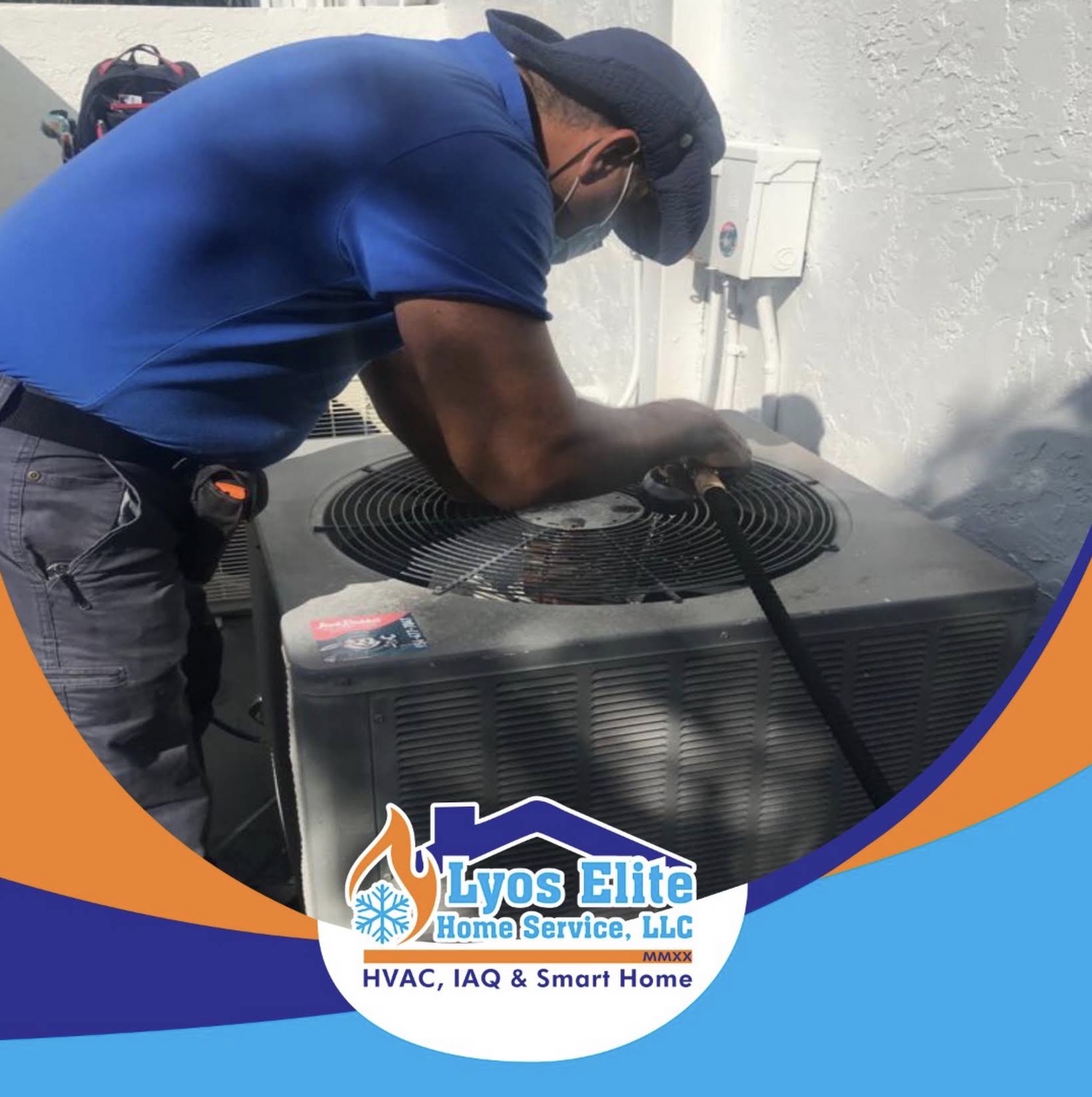 Lyos Elite technician servicing an outdoor A/C condenser